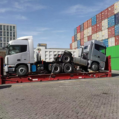 Carga RORO/OOG de un agente de carga chino para camiones de basura y mezcladores y tractores de hormigón